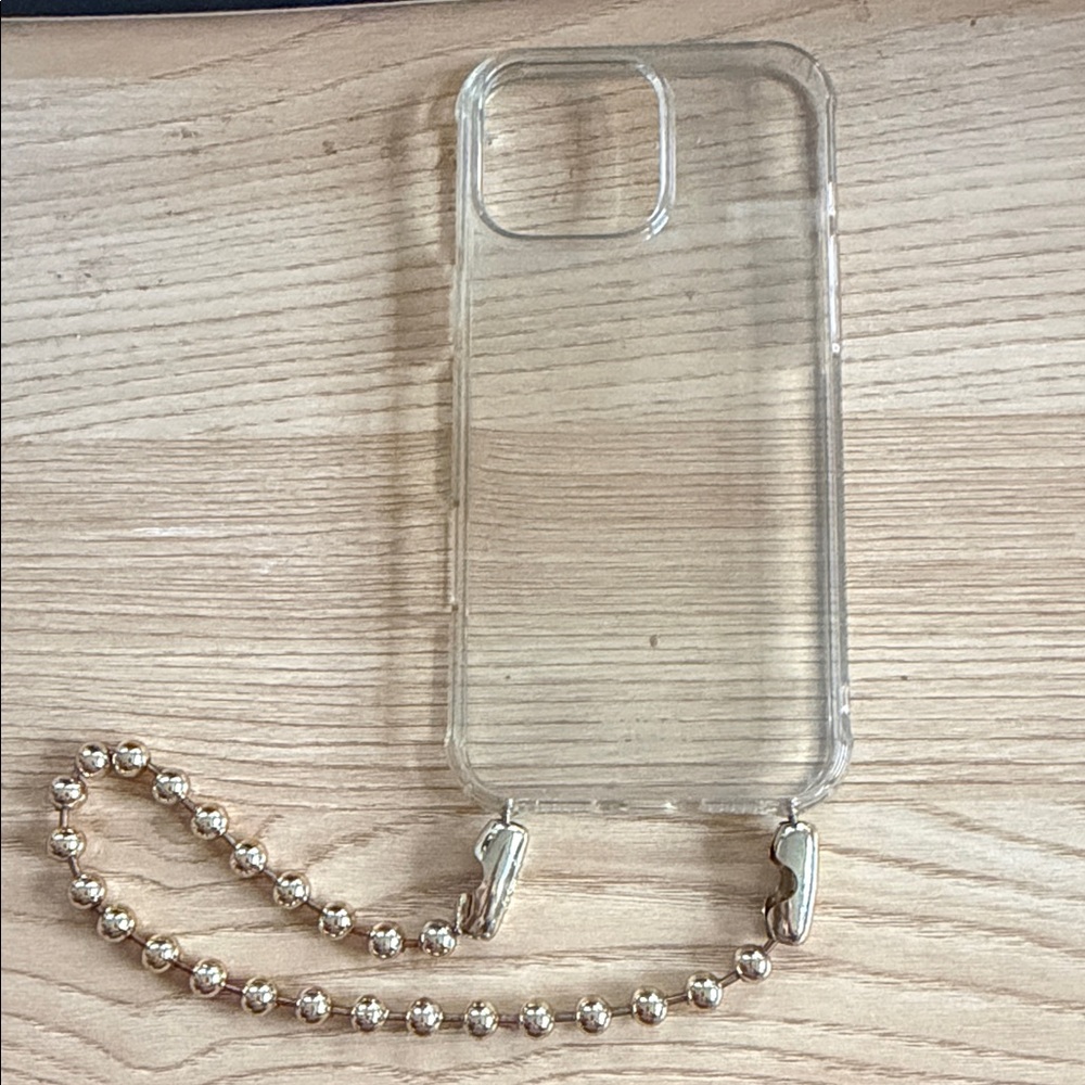 OSSA New York gold ball chain wristlet and iPhone 16 Pro Max case